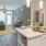 kitchen island and bar area with easy access to large living room