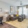 living room with large open spaces and excellent lighting from large window/patio doors