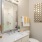 bathroom with large mirror and space