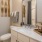 bathroom with a large mirror and ample counter-space